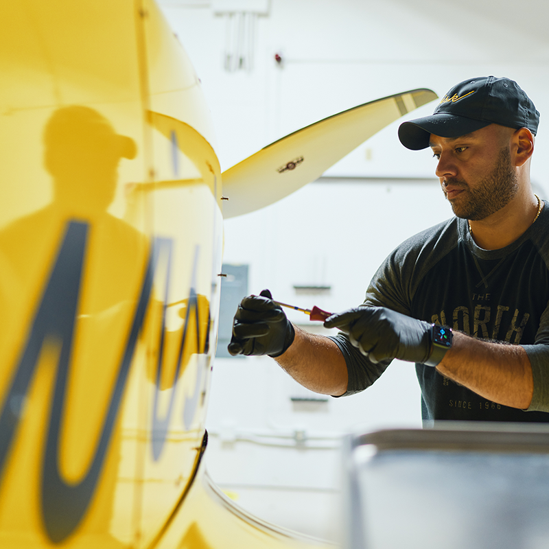 Careers_TransformFuture2_800x800 Person working on an exterior panel of the aircraft